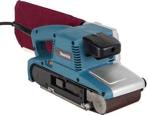 Ručná pásová brúska upevnená k stolu