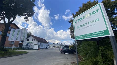 Pohľad na asfaltovaciu súpravu AMMANN CB 180 v plnej prevádzke