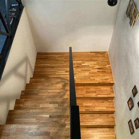 Rodinné schodisko obložené podlahou Quick-Step